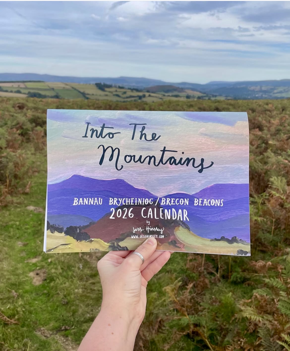 Front of calendar by artist Jess Hinsley depicting a mountain scene with the Brecon Beacons in the background