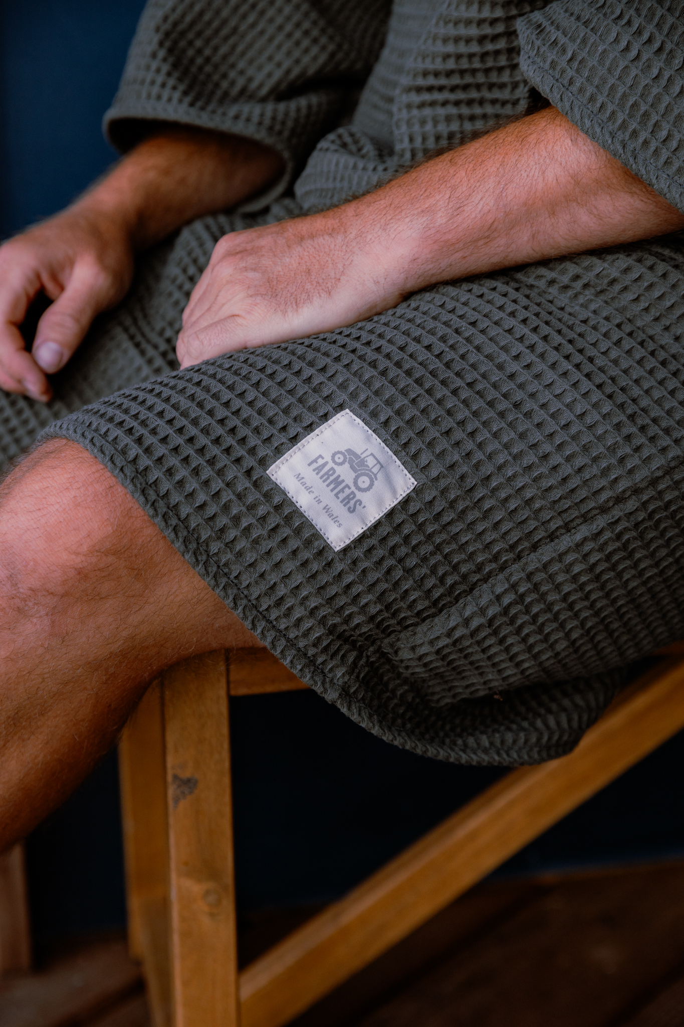 Close up of FARMERS' badge with tractor image on bottom right corner of Waffle robe